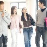 College,Students,Walking,Down,The,Hall